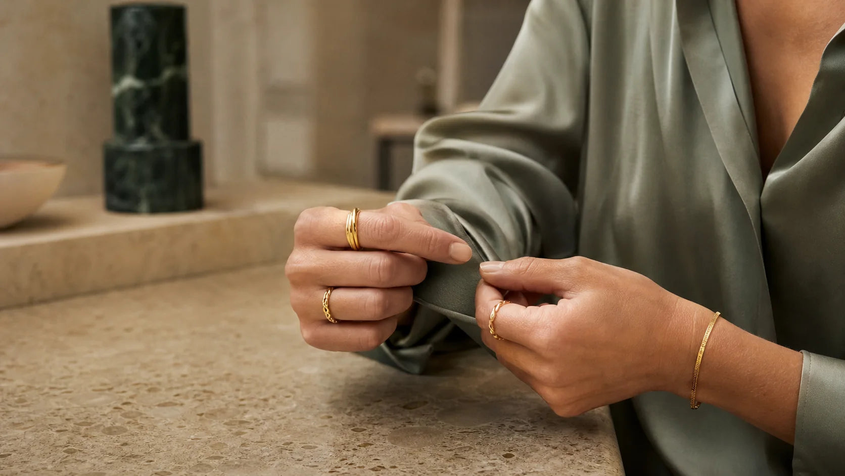 Gold jewellery styled in soft daylight